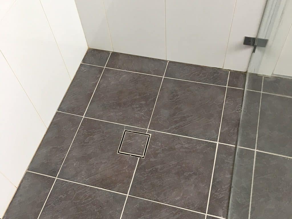 ceramic shower base regrouted