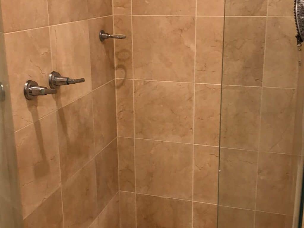 after shower restoration on a marble shower with new grout